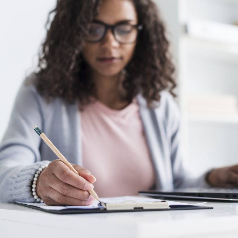ethnic-young-female-writing-clipboard ethnic-young-female-writing-clipboard