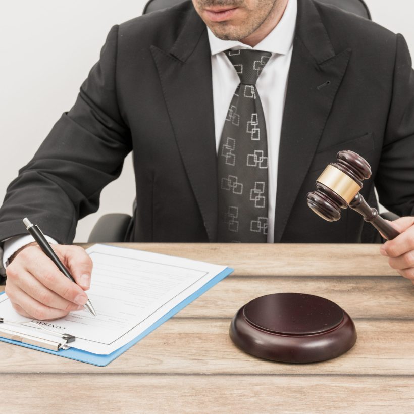 lawyer-filling-document lawyer-filling-document